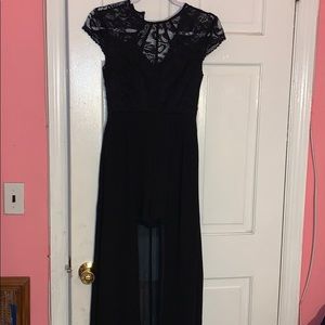 Black lace dress has shorts with long tale